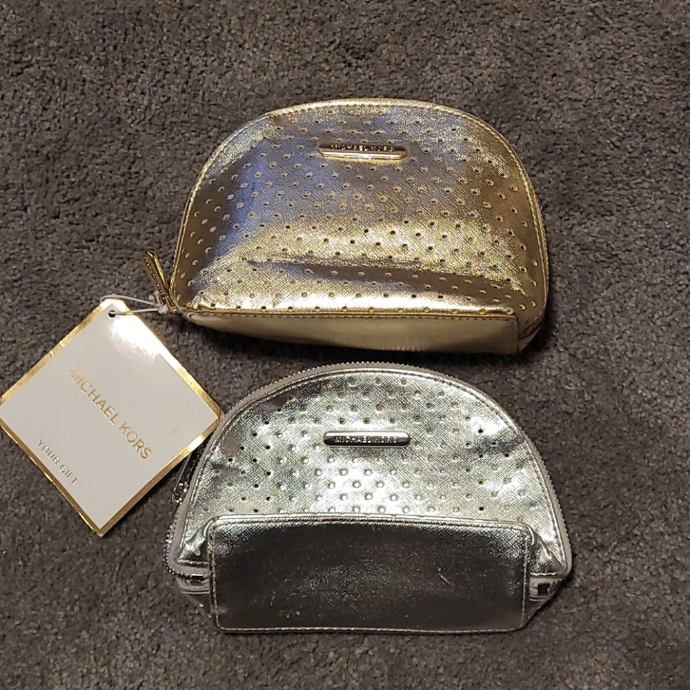 Silver and Gold MK cosmetic or small clutch bags.